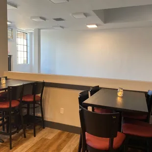 Private event space area. TVs are here if you want to watch anything. The open area overlooks the brew area below!