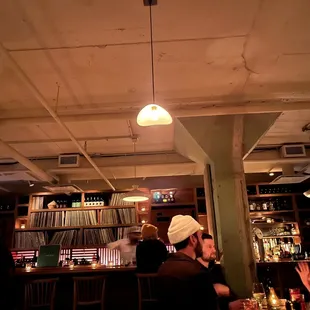 a group of people sitting at a bar