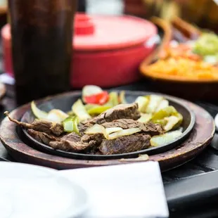 a plate of meat and vegetables