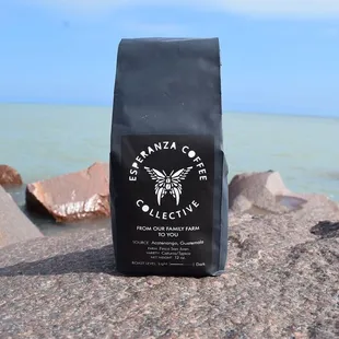 ground coffee on a rock by the ocean