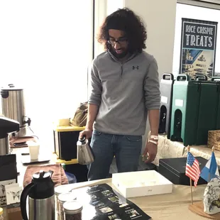 a man pouring coffee
