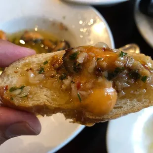 Bread dipped in the Patatas Bravas/Gambas Al Ajillo sauce-