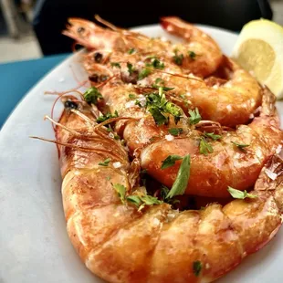 2nd shot of the head on grilled shrimp . Peeled perfectly so much flavor.