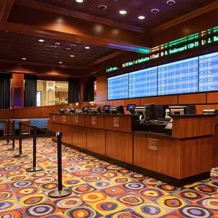 a bar with a large screen in the background