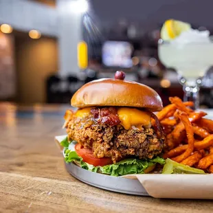 a burger and fries on a table