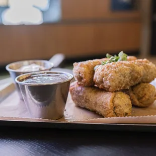 a plate of fried chicken nuggies with dipping sauce