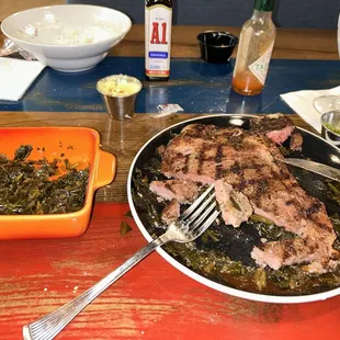 Half of my T-bone with collard greens