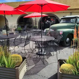 an old truck parked in front of a restaurant