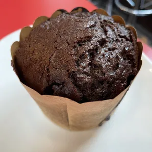 a chocolate muffin on a plate