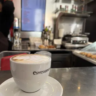 a cup of coffee on a saucer