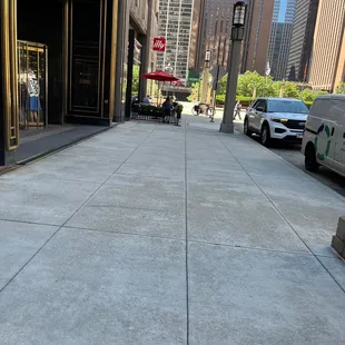 an empty sidewalk in a city