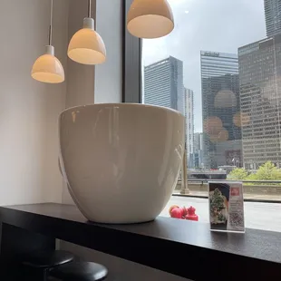 a large white bowl on a counter