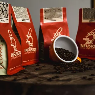 three bags of coffee on a table