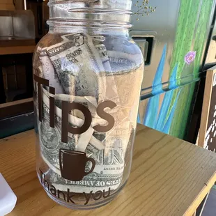 a glass jar with money in it