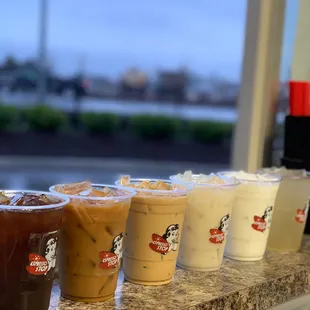 a row of iced coffees