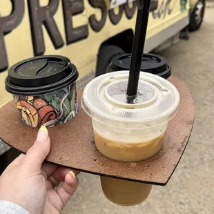 a person holding a cup of coffee