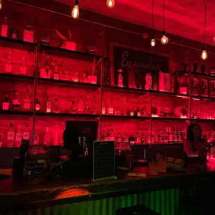 a bar with red lighting