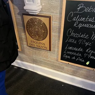 a person standing in front of a sign