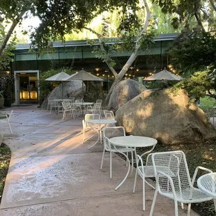 tables and chairs in a courtyard
