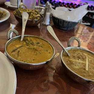 Lamb Biryani, Vegetable Khorma on the left but sharing the foreground with a Dal Makhani