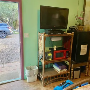 Inside #12 - Every room has a little fridge, microwave and TV with DVD and VCR combo. LOTS of movies on site you can take back to your room.