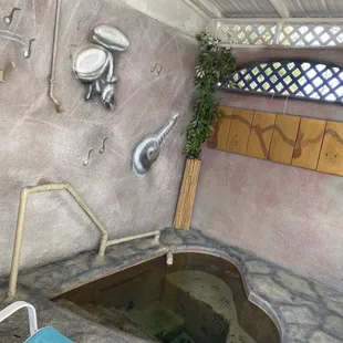 Hot spring room 6 of 6. Cute, heart, shape, and a music theme. This is the hottest of all of them, around 106°.