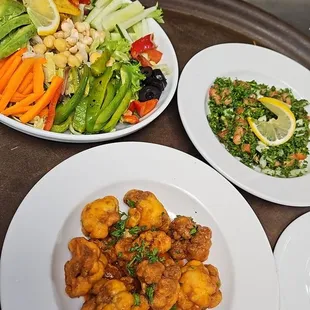 a variety of plates of food on a table