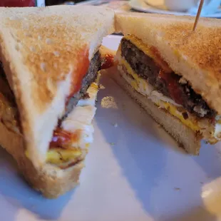 Fried egg, American cheese, scrapple on white toast with ketchup