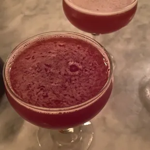 two cocktails on a marble table