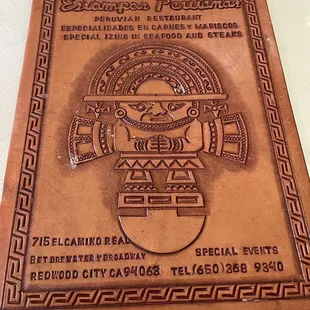 Tooled leather menu cover