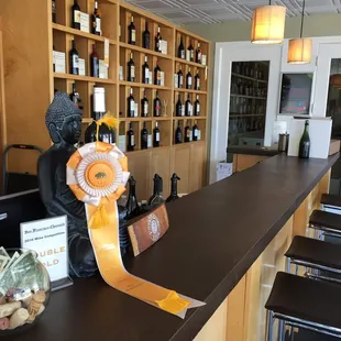a bar with wine bottles and a ribbon