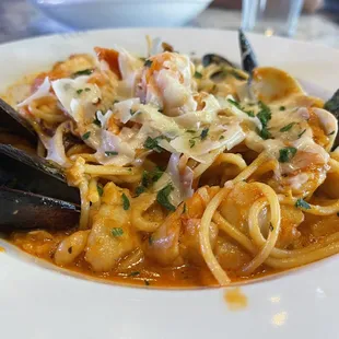 Seafood pasta with fish shrimp calamari Manila clams mussels scallops .. so delicious