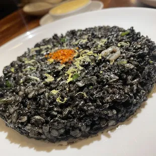 Fried arroz negro, squid, and romesco