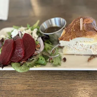 Combo with farmstead salad &amp; tuna salad on pretzel brioche, yum!