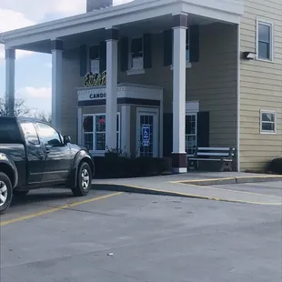 a truck parked in front of a store