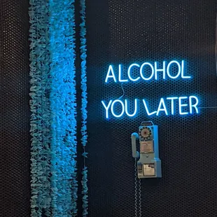 a neon sign that says alcohol you later