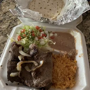 Steak rice and beans salad and flour tortillas