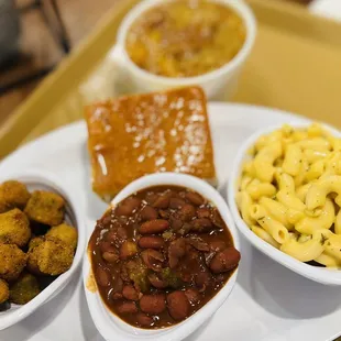 Veggie Combo: Mac N Cheese, Red Beans, fried Okra, and cornbread with Peach Cobbler