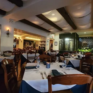 a dining room with tables and chairs