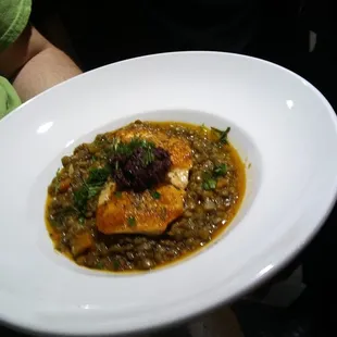 Solomo Pan-seared 6 ounce Scottish salmon, lentils, olive tapenade lemon vinaigrette