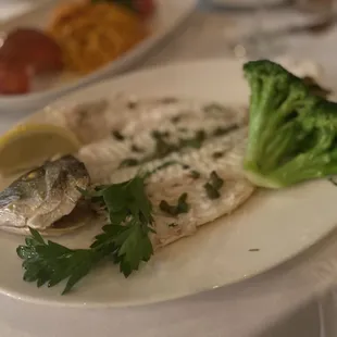 WHOLE GRILLED DORADE ROYALE mediterranean sea bream, served with ladolemono and steamed broccoli