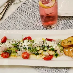 Ceviche and Tito with seltzer and cranberry