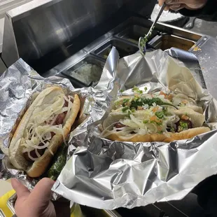 two hot dogs in foil