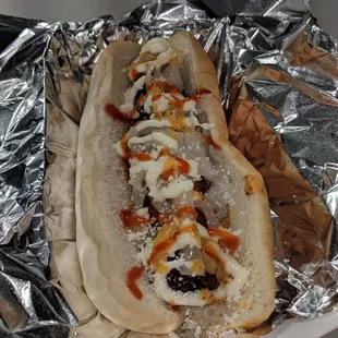 Hot dog wrapped with bacon 5 bucks (sauces on the side truck)