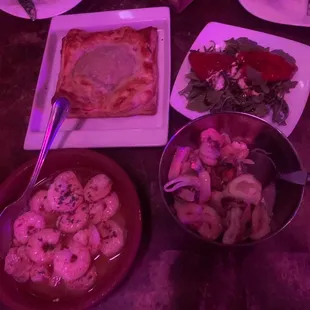 Salpicon de Mariscos (bottom right), Gambas Al Ajillo (bottom left), Empanada de Cordero (top left), Piquillos Rellenos (top right)