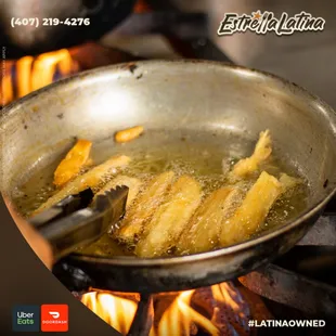 frying fish in a frying pan