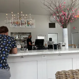 a man standing at the bar