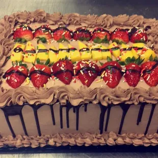 a chocolate cake with strawberries on top
