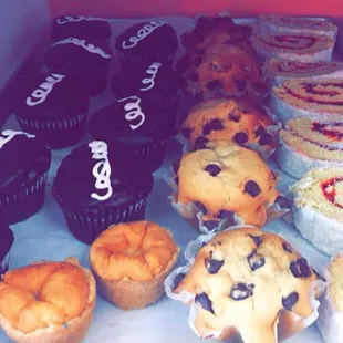 Mini cheesecakes, chocolate muffin, and strawberry coconut bun