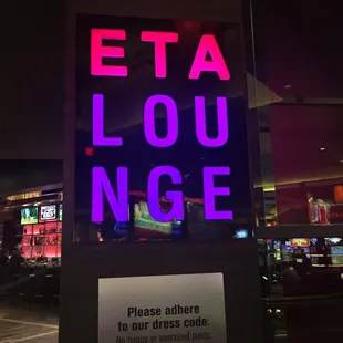 a neon sign in a dark room